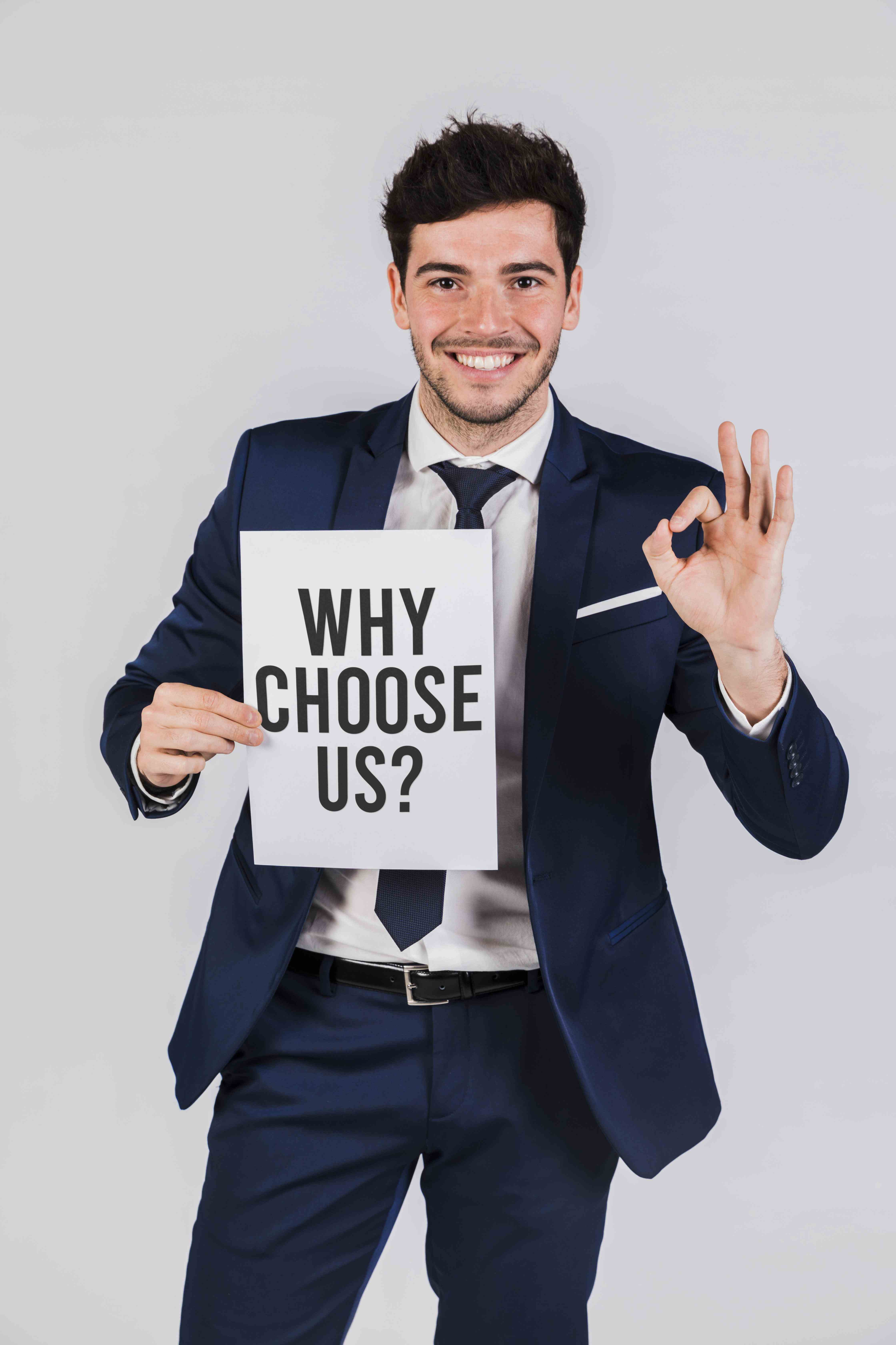 business man holding paper with why choose us question (1) business man holding paper with why choose us question (1)